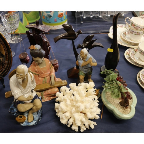 45 - Chinese pottery and wooden figurines, other figurines and curios and a small piece of coral.