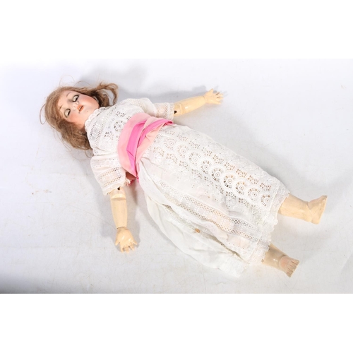 51 - Early 20th century bisque headed doll.