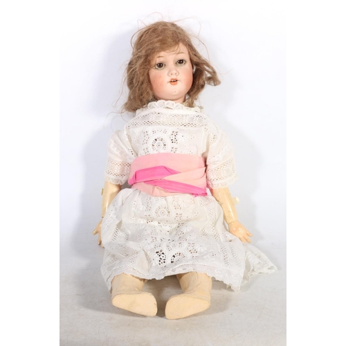 51 - Early 20th century bisque headed doll.