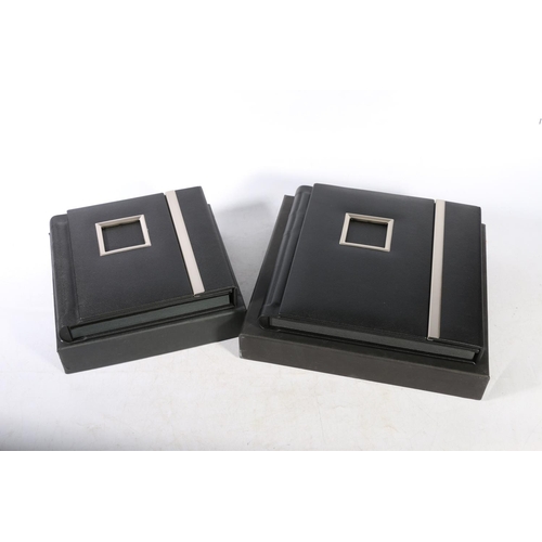 61 - Two leather bound photograph albums, unused in original boxes.