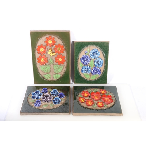 72 - Four Scandinavian Art Pottery Jie Grantofta of Sweden wall plaques with raised floral decoration.