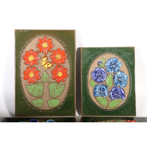 72 - Four Scandinavian Art Pottery Jie Grantofta of Sweden wall plaques with raised floral decoration.