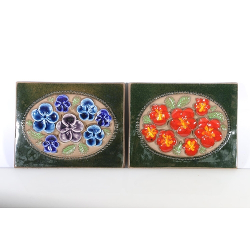 72 - Four Scandinavian Art Pottery Jie Grantofta of Sweden wall plaques with raised floral decoration.