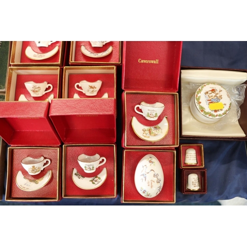 74 - Miniature Caverswall cups and saucers, and Caverswall thimbles, all boxed.