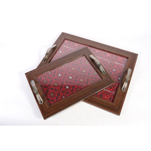 83 - Two wooden framed trays with tapestry insets under glass.