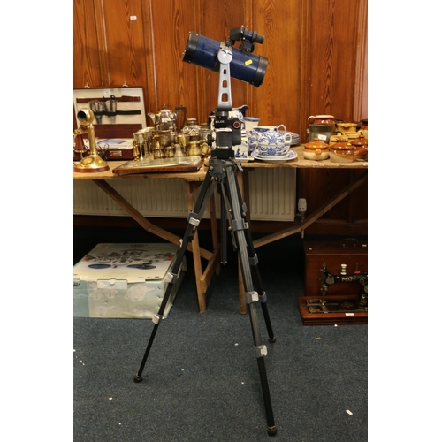 85 - Telescope on tripod stand.