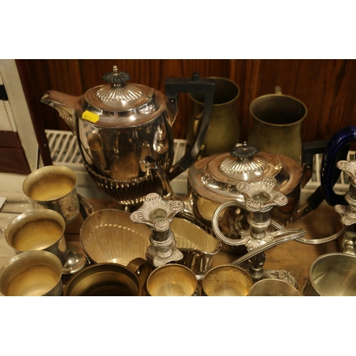 92 - Silver-plate to include a tea and coffee set, and brassware.