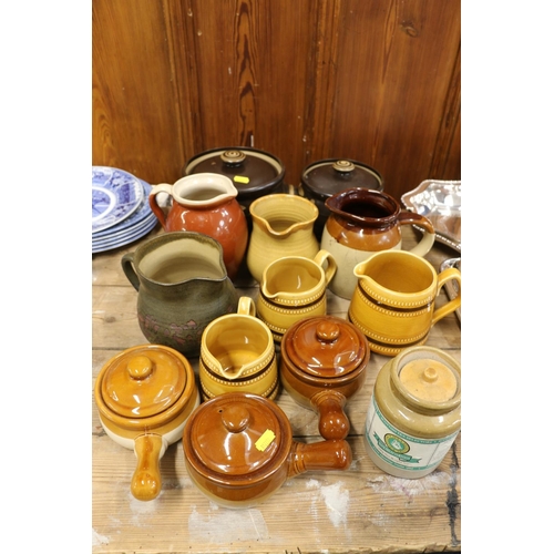 98 - Brown and treacle glazed pottery to include tureens, jugs, etc.