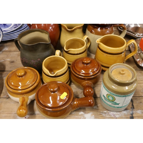 98 - Brown and treacle glazed pottery to include tureens, jugs, etc.