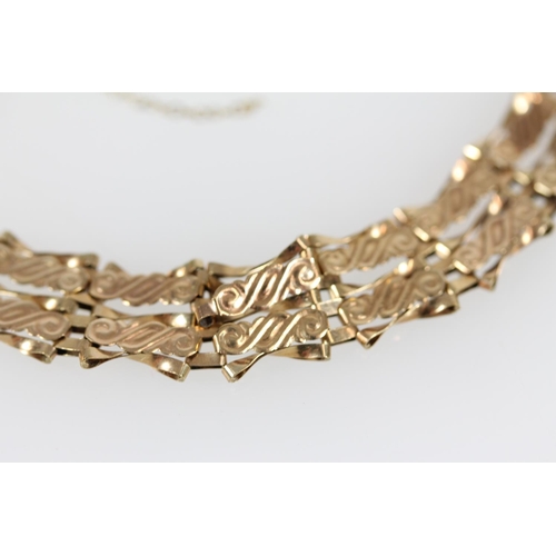 507 - 9ct gold fancy link gate bracelet, 5.4g.