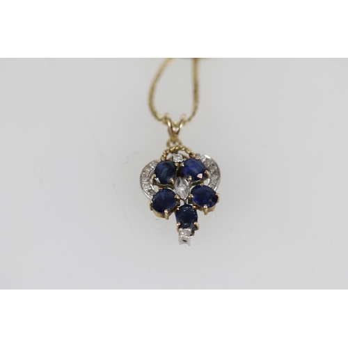 508 - 14ct gold sapphire and white stone pendant on 14ct gold chain, 4.7g.