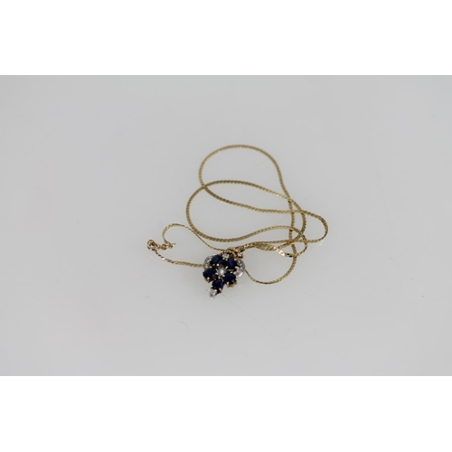 508 - 14ct gold sapphire and white stone pendant on 14ct gold chain, 4.7g.