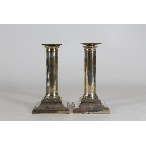 545 - Pair of Edwardian silver candlesticks by Thomas A Scott, Sheffield 1910, 1054g loaded, 16cm tall.