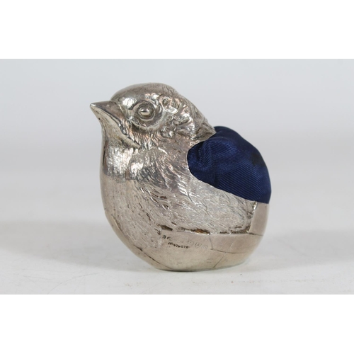 554 - Edward VII silver pin cushion in the form of a chick, Sampson Mordan & Co., Chester 1909, H6cm.