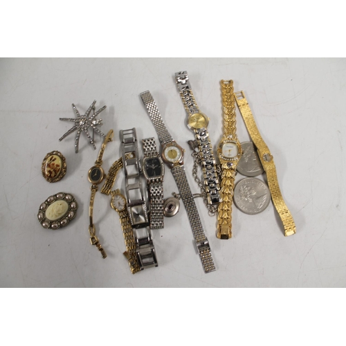 528 - Selection of ladies dress watches, costume jewellery and two commemorative crowns.