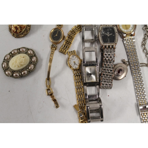 528 - Selection of ladies dress watches, costume jewellery and two commemorative crowns.