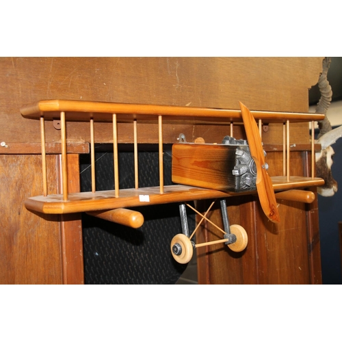 154 - Vintage wooden wall ornament in the form of a bi-plane, 76cm wide.