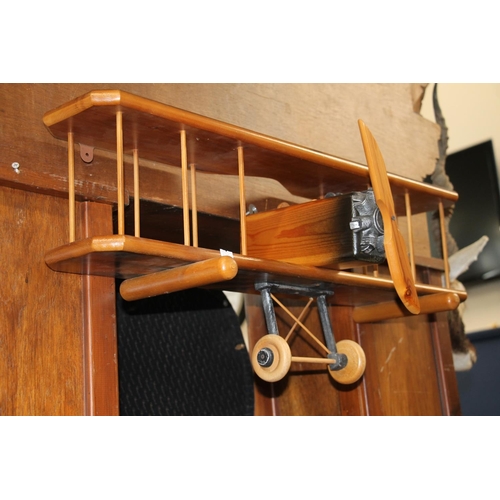 154 - Vintage wooden wall ornament in the form of a bi-plane, 76cm wide.