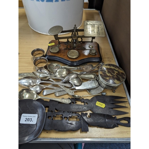 203 - Postal scales, silver-plated items and a tribal style wall hanging fork and spoon.