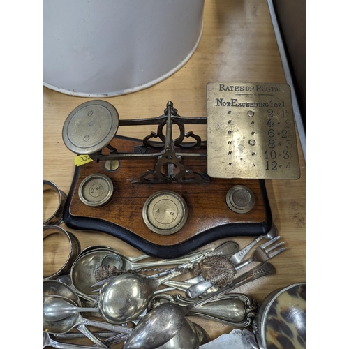 203 - Postal scales, silver-plated items and a tribal style wall hanging fork and spoon.