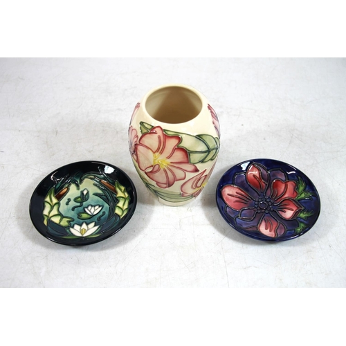 218 - Moorcroft vase and two pin dishes.