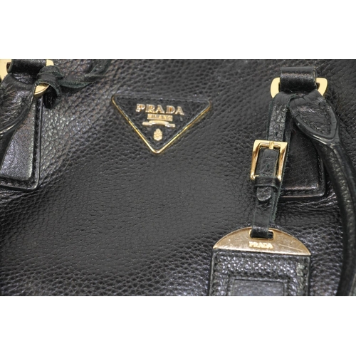 222 - Leather handbag in the manner of Prada.