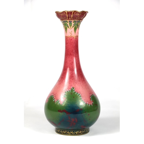 245 - Early 20th century pottery vase with pink and green stitch pattern, sceptre mark to base, 26cm high.