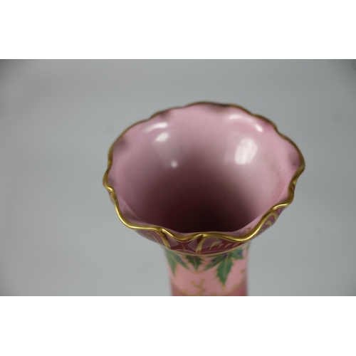 245 - Early 20th century pottery vase with pink and green stitch pattern, sceptre mark to base, 26cm high.