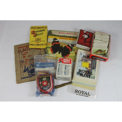 254 - Curios to include playing cards, cigarette cards, cloth badges, picture cards, etc.