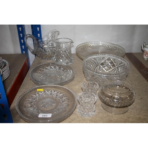 283 - Glassware to include cut glass plates, water jug, fruit bowl, etc.