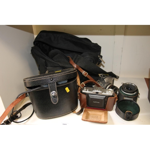 289 - Cased binoculars and cameras.