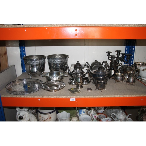 292 - Shelf containing silver plate to include teapots, sugar and cream, a quaich, jardinières, etc.