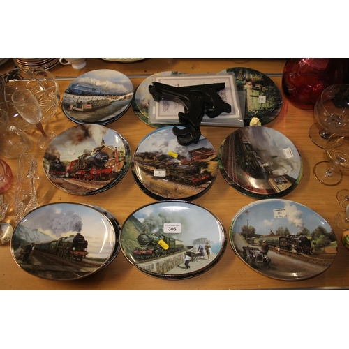 306 - Glassware and collectors plates to include trains.