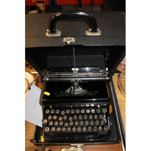 307 - Cased typewriter.