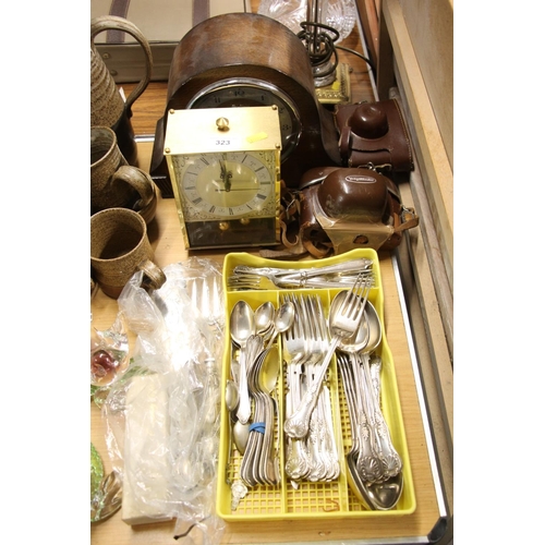 323 - Mantel clock, flatware, etc.