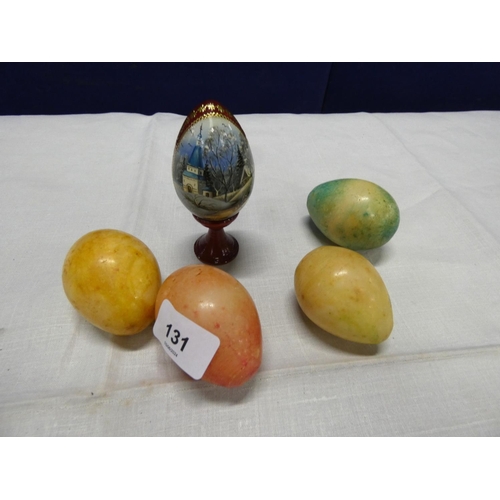 131 - Four stone eggs and a Russian painted egg.