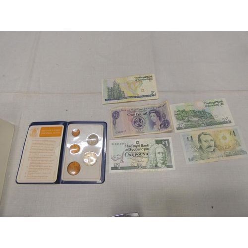 180 - Various £1 notes and British coins.