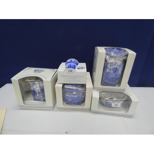 186 - Ringtons blue and white ware to include tea caddies, jug, bowl.