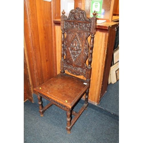 641 - Victorian oak hall chair, the back heavily carved with baroque decoration.