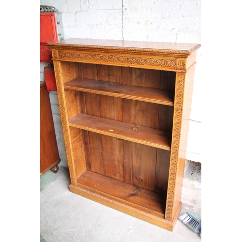 558 - Carved oak bookcase, 123cm high.