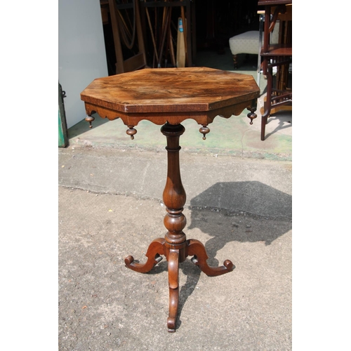 562 - Victorian walnut topped occasional table on tripod support, 76cm high.