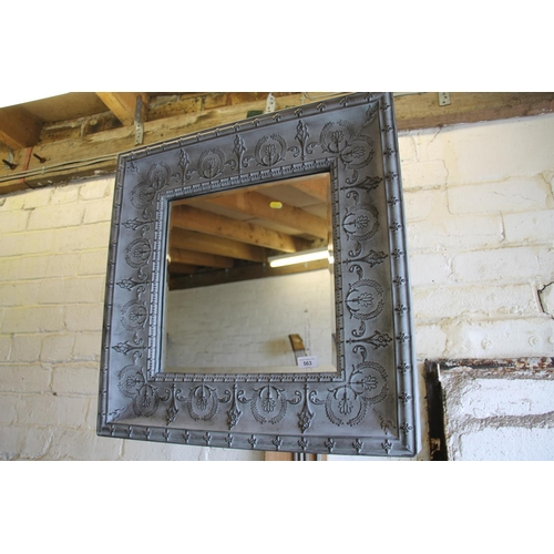 563 - Wall mirror, 68cm high.