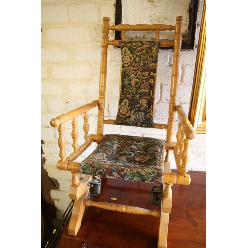 568 - Small American pine child's rocking chair, 73cm high.