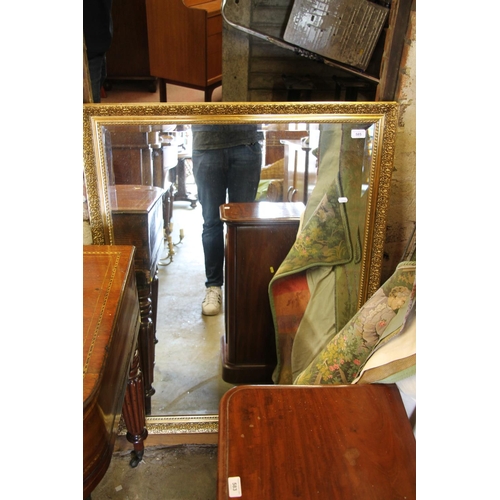 585 - Gilt framed wall mirror, 112cm high.