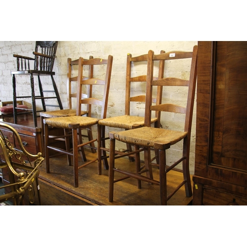 592 - Four ladderback chairs with rush seats.