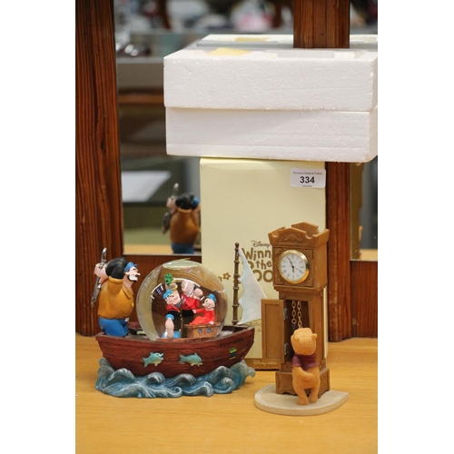 334 - Disney's Winnie the Pooh grandfather clock model and a Popeye snow globe,  (2)