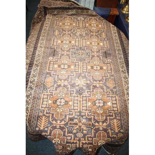 690 - Afghan rug in brown and beige colour, 190cm x 115cm.