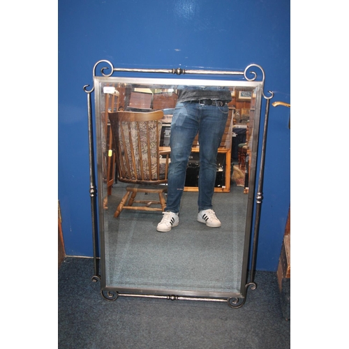 691 - Metal framed wall mirror, 105cm tall.