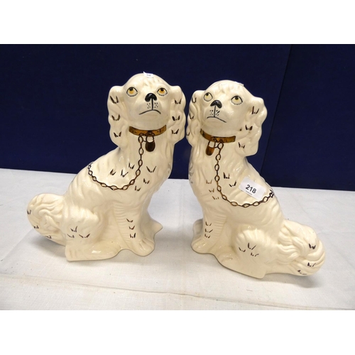 218 - Pair of modern pottery dogs.