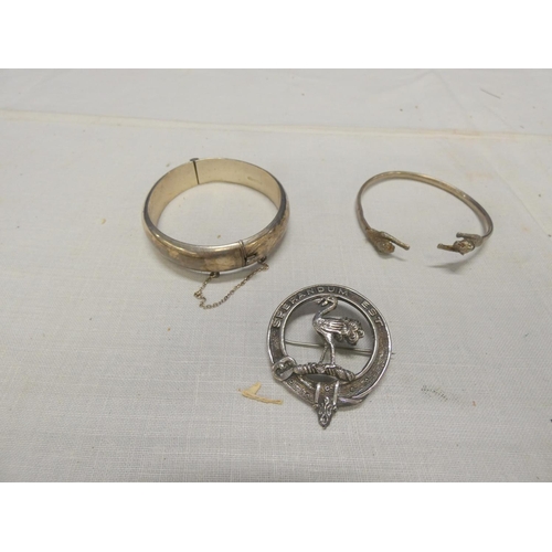 250 - Hinged silver bangle, silver panther bracelet and a clan badge (3)